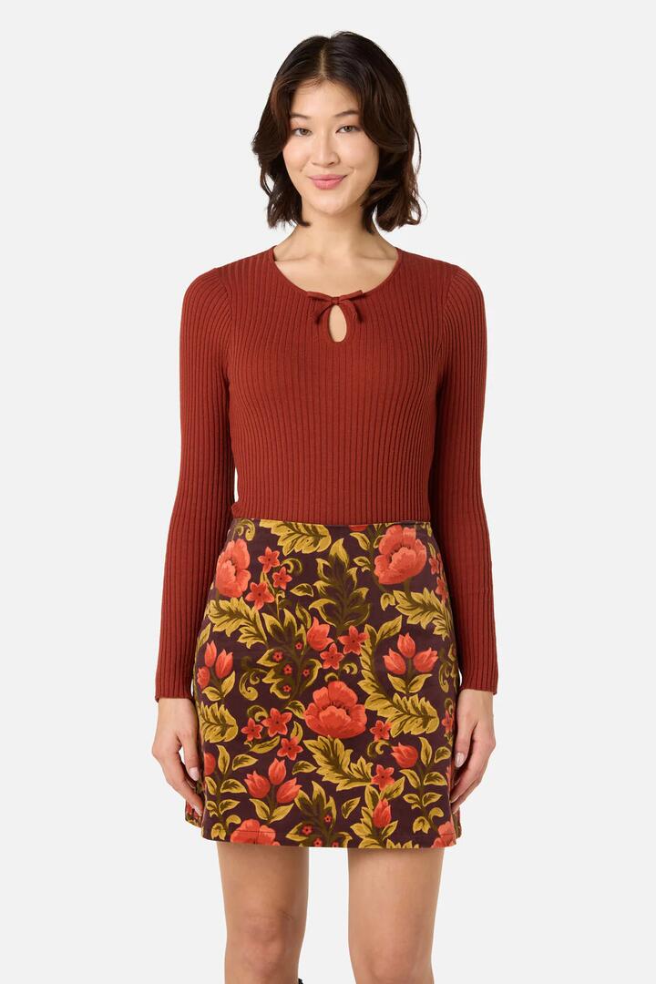 Image of a model wearing Tops. Productname: Anna Bow Knit Top in Rust colour by brand - Princess Highway