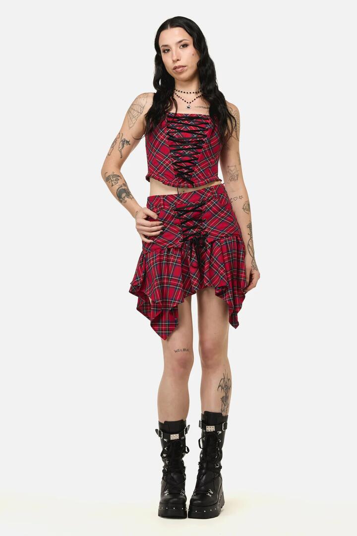 Image of a model wearing Skirts. Productname: Rad Goth Hanky Tartan Skort in Black Red colour by brand - Black Friday