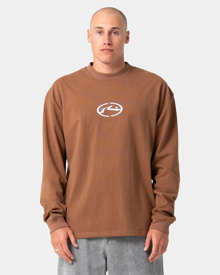 Image of a model wearing Tops. Product name - Rusty Mens Turbo Long Sleeve T-Shirt Pinecone in Pinecone colour by brand - Rusty