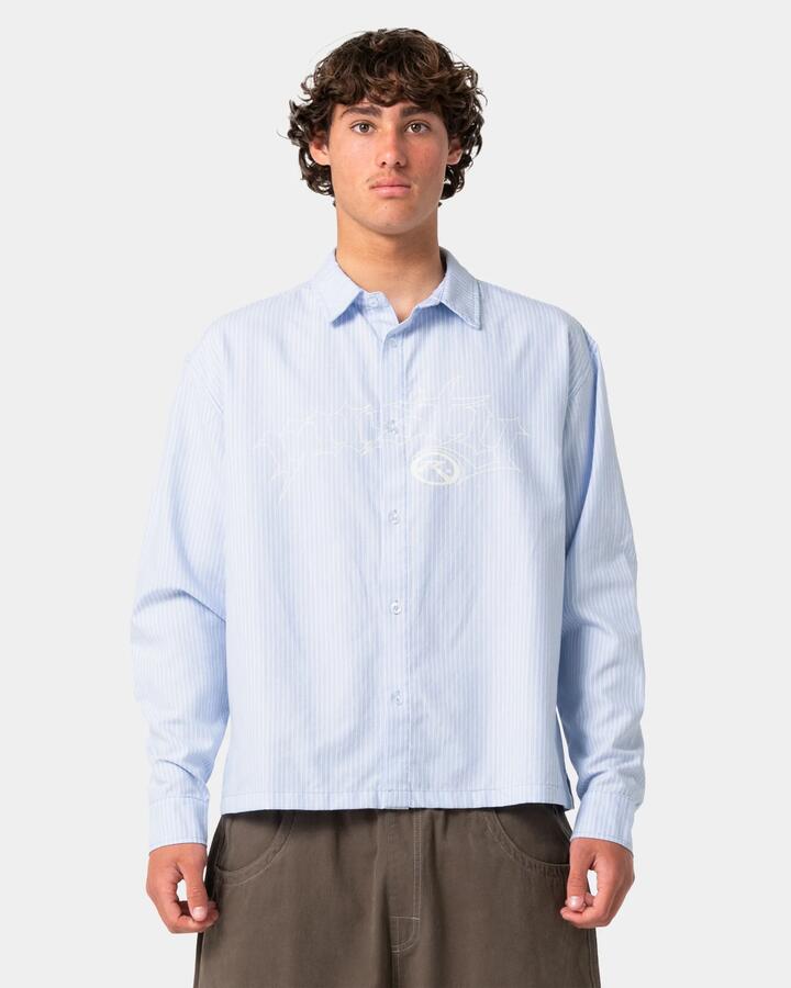 Image of a model wearing Tops. Product name - Rusty Mens Freaker Long Sleeve Shirt Sky Blue in Sky Blue colour by brand - Rusty