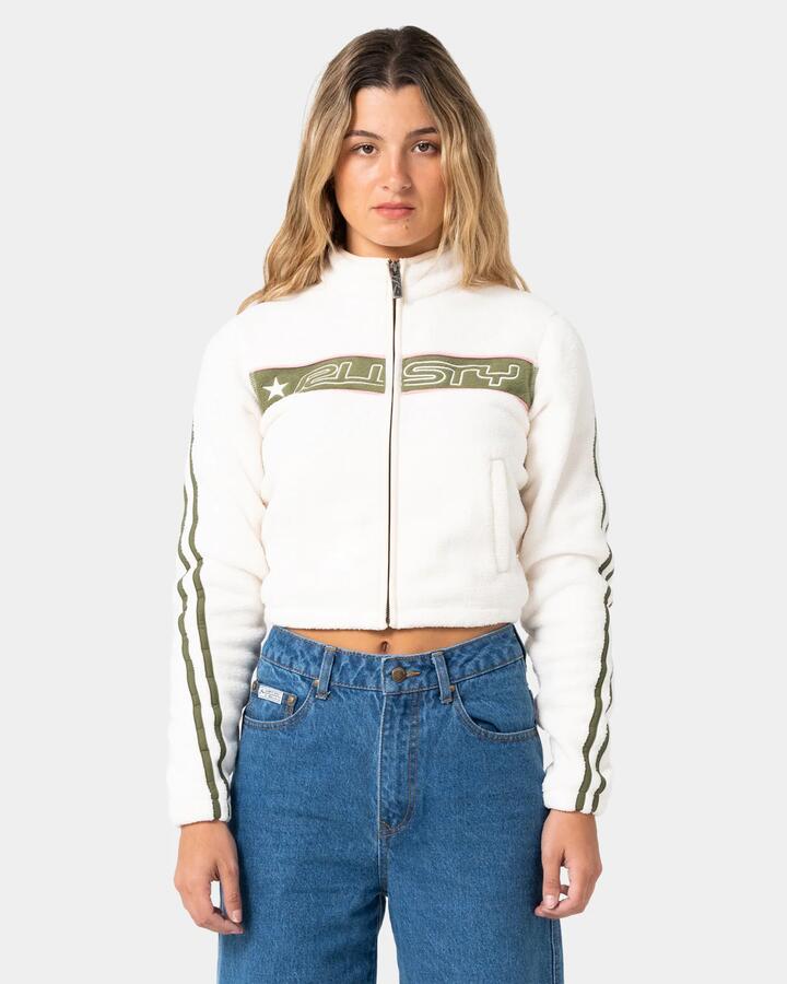 Image of a model wearing Outerwear. Product name - Rusty Womens Freeway Crop Polar Fleece Jacket Cream in Cream colour by brand - Rusty