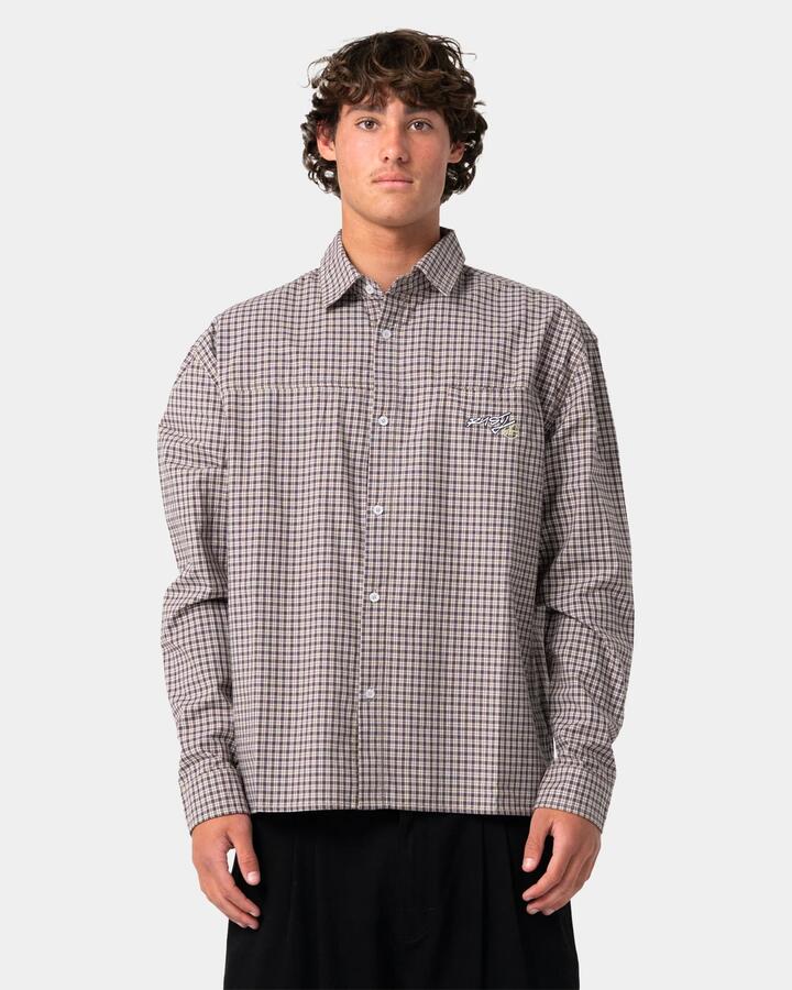 Image of a model wearing Tops. Product name - Rusty Mens Roadblock Long Sleeve Shirt Pinecone in Pinecone colour by brand - Rusty