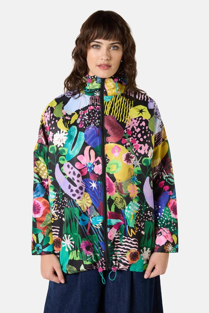 Image of a model wearing Rain Coats. Product name - Electric Eden Raincoat in Print colour by brand - Gorman