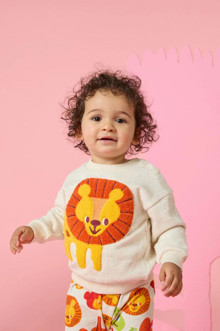 Image of a model wearing Outerwear. Product name - Lion Baby Sweater in Cream colour by brand - Gorman