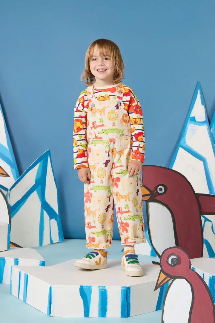 Image of a model wearing Pants. Product name - Animals Kids Overalls in Oatmeal colour by brand - Gorman