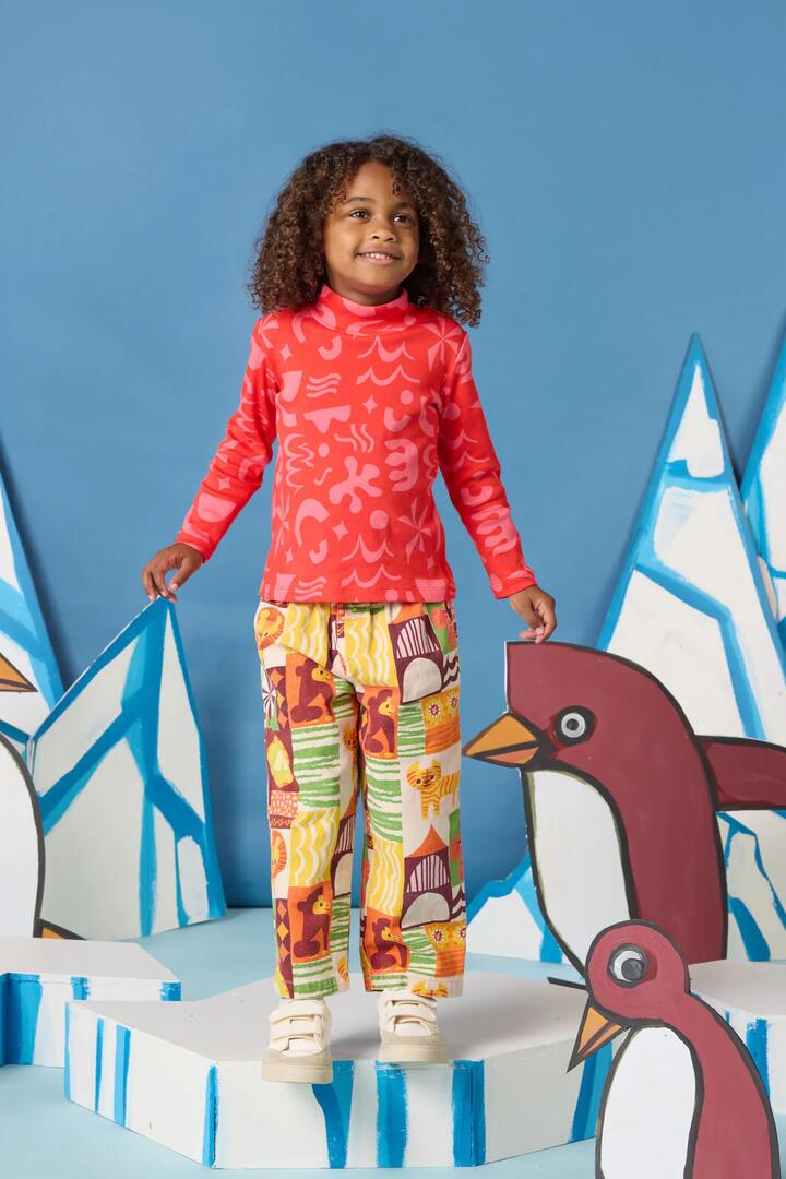 Image of a model wearing Tops. Product name - Playful Shapes Kids Skivvy Top in Red colour by brand - Gorman