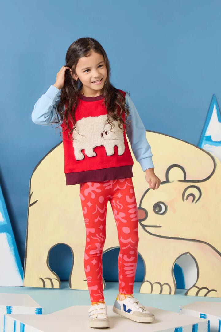 Image of a model wearing Pants. Product name - Playful Shapes Kids Legging in Red colour by brand - Gorman