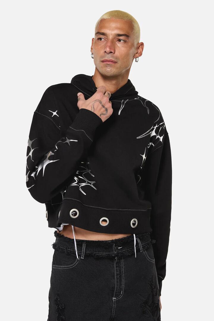Image of a model wearing Outerwear. Productname: Y2K Sigil Eyelet Hoodie in Black colour by brand - Dangerfield