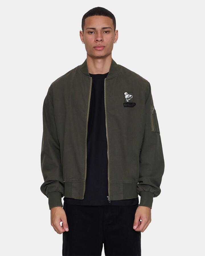 Image of a model wearing Outerwear. Product name - Thrills Mens Rose Brigade Bomber Jacket Olive Night in Olive Night colour by brand - Thrills