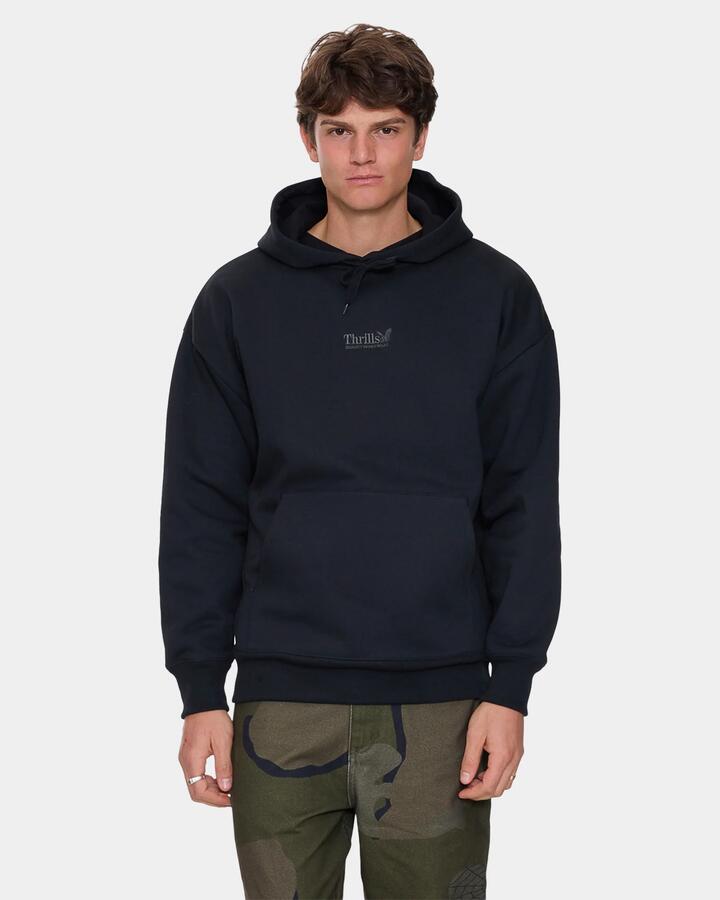 Image of a model wearing Outerwear. Product name - Thrills Mens Thrills Union Slouch Pullover Hoodie Pirate Black in Pirate Black colour by brand - Thrills