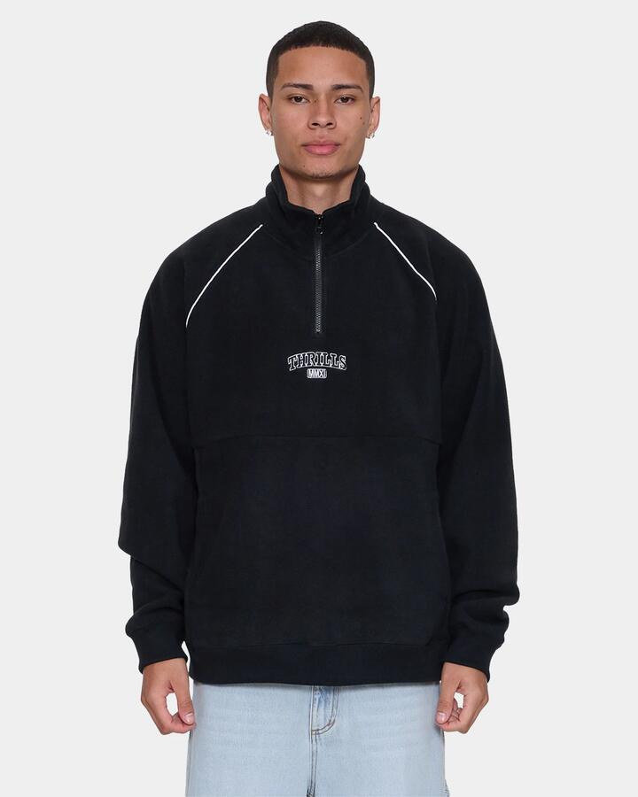 Image of a model wearing Outerwear. Product name - Thrills Mens Thrill Of Victory Raglan Quarter Zip Fleece Jumper Faded Black in Faded Black colour by brand - Thrills