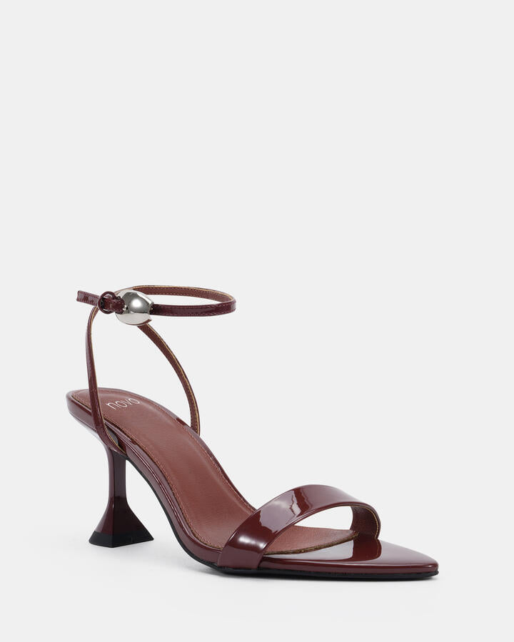 Image of Heels. Product name - Zibit Plum Patent Vegan Heels in Plum Patent colour by brand - Novo
