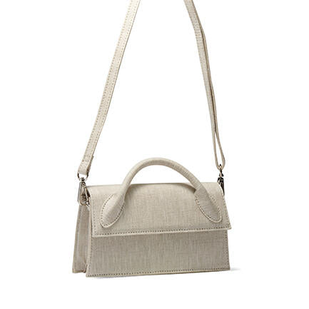 Image of a model wearing Shorts. Product name - Artesia Linen Handbags in Neutral colour by brand - Novo