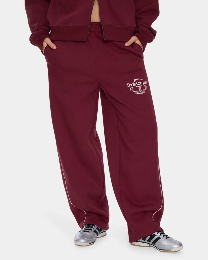 Image of a model wearing Pants. Product name - Thrills Womens End Game Track Pants New Maroon in New Maroon colour by brand - Thrills
