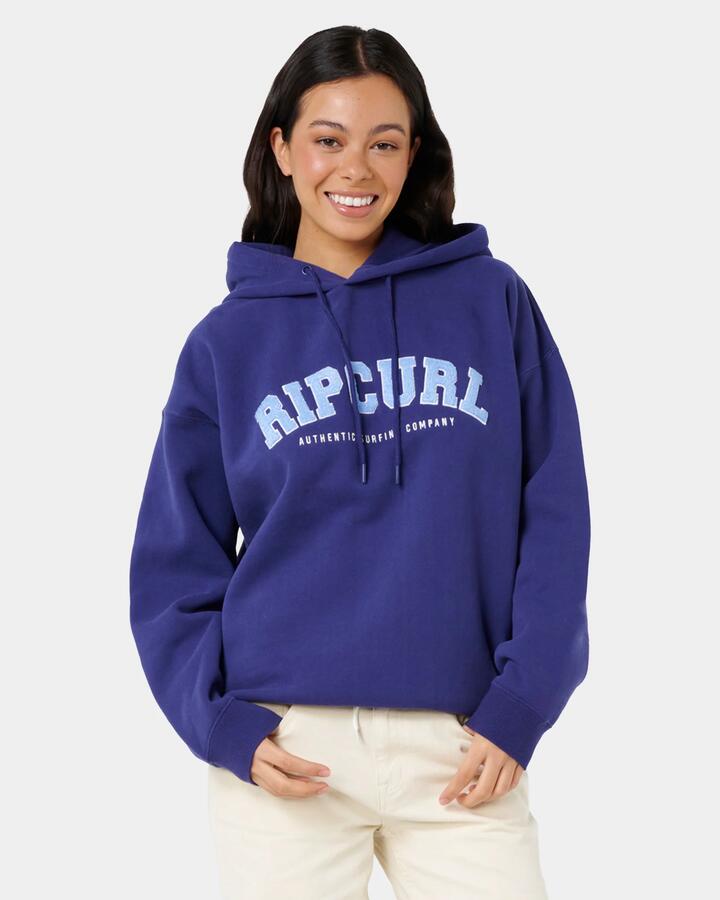Image of a model wearing Outerwear. Product name - Rip Curl Womens Varsity Pullover Hoodie Dark Blue in Dark Blue colour by brand - Rip Curl