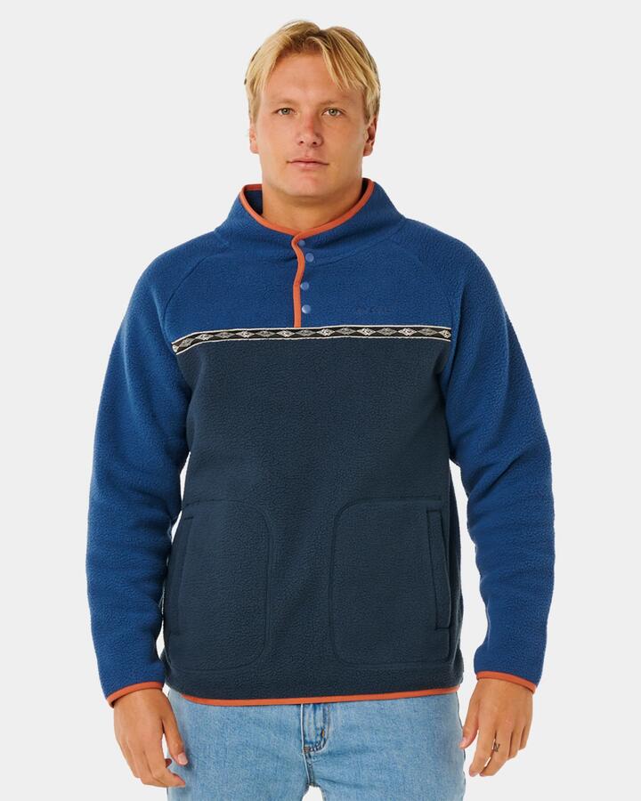Image of a model wearing Outerwear. Product name - Rip Curl Mens Heritage Polar Fleece Jumper Light Navy in Light Navy colour by brand - Rip Curl