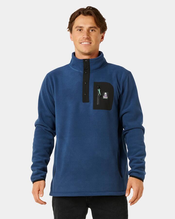 Image of a model wearing Outerwear. Product name - Rip Curl Mens Search Polar Fleece Jumper Light Navy in Light Navy colour by brand - Rip Curl
