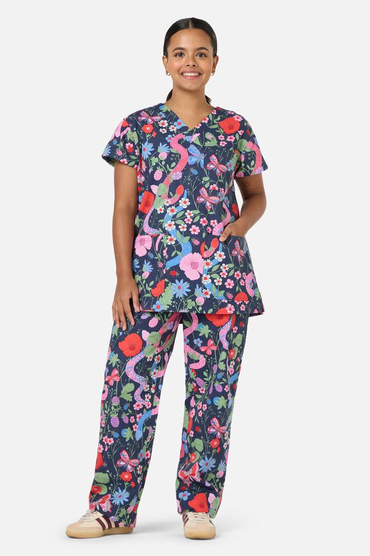 Image of a model wearing Uniforms & Workwear. Productname: Snakes & Flora Scrub Set in Navy colour by brand - Scrubs With Love