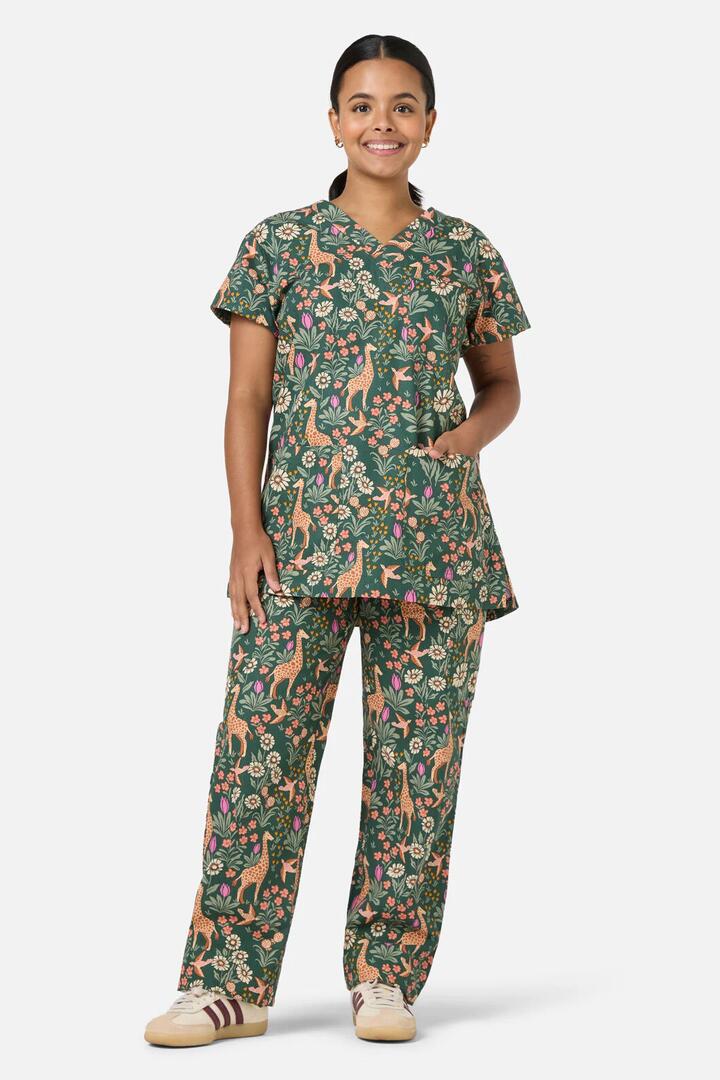 Image of a model wearing Uniforms & Workwear. Productname: Giraffe Scrub Set in Green colour by brand - Scrubs With Love