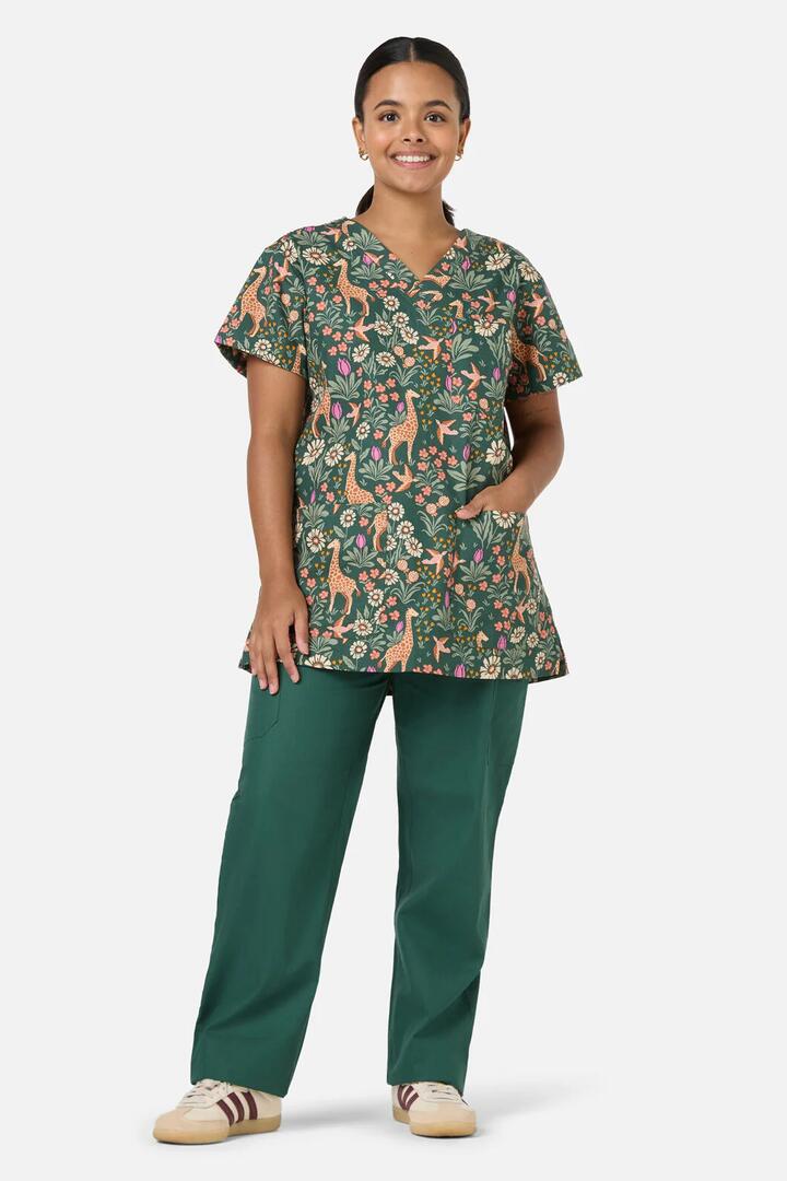 Image of a model wearing Uniforms & Workwear. Productname: Giraffe Top & Pant Scrub Set in Green colour by brand - Scrubs With Love