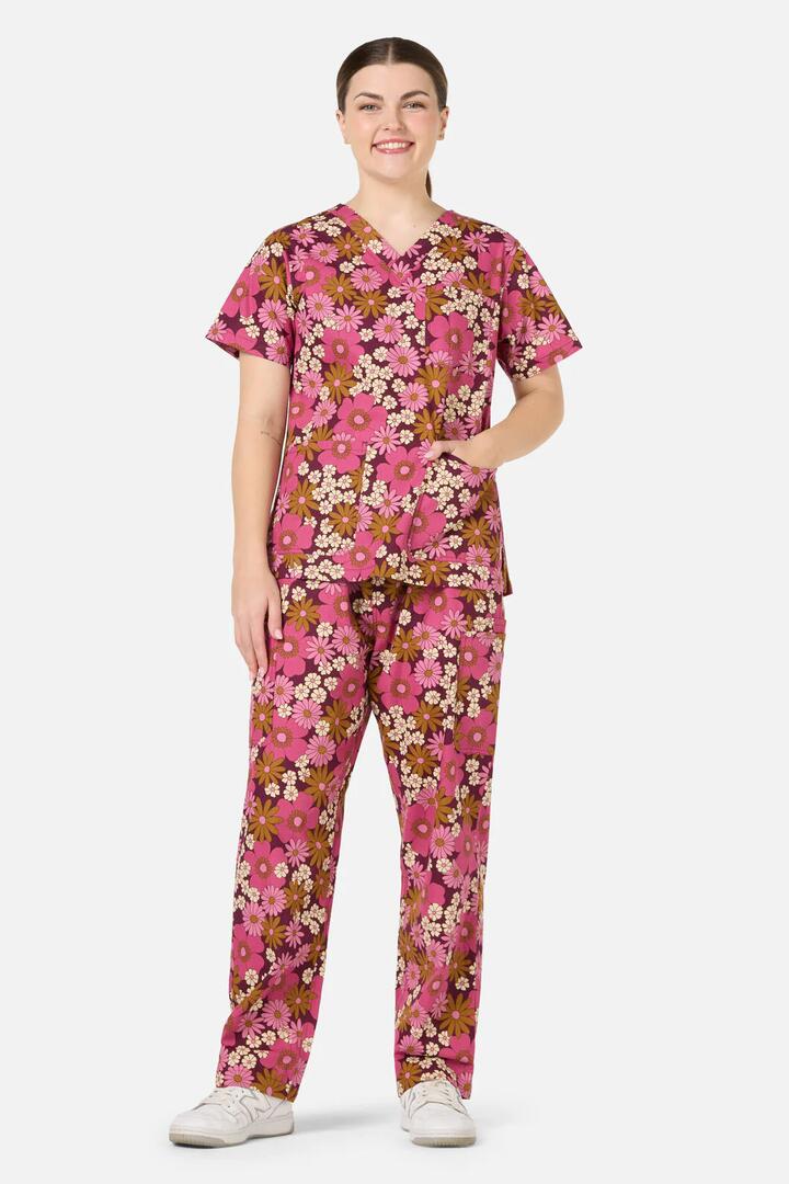 Image of a model wearing Uniforms & Workwear. Productname: Brigette Scrub Set in Pink colour by brand - Scrubs With Love