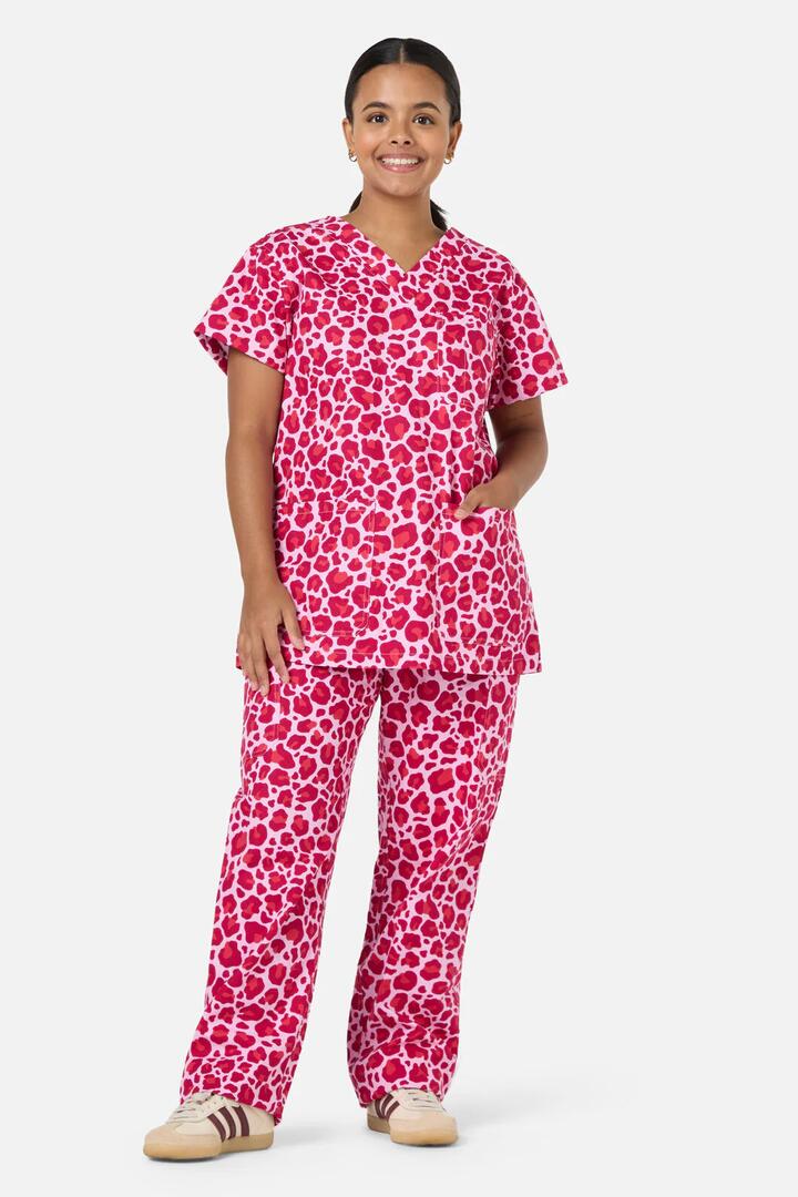 Image of a model wearing Uniforms & Workwear. Productname: Leopard Cub Scrub Set Pink in Pink colour by brand - Scrubs With Love