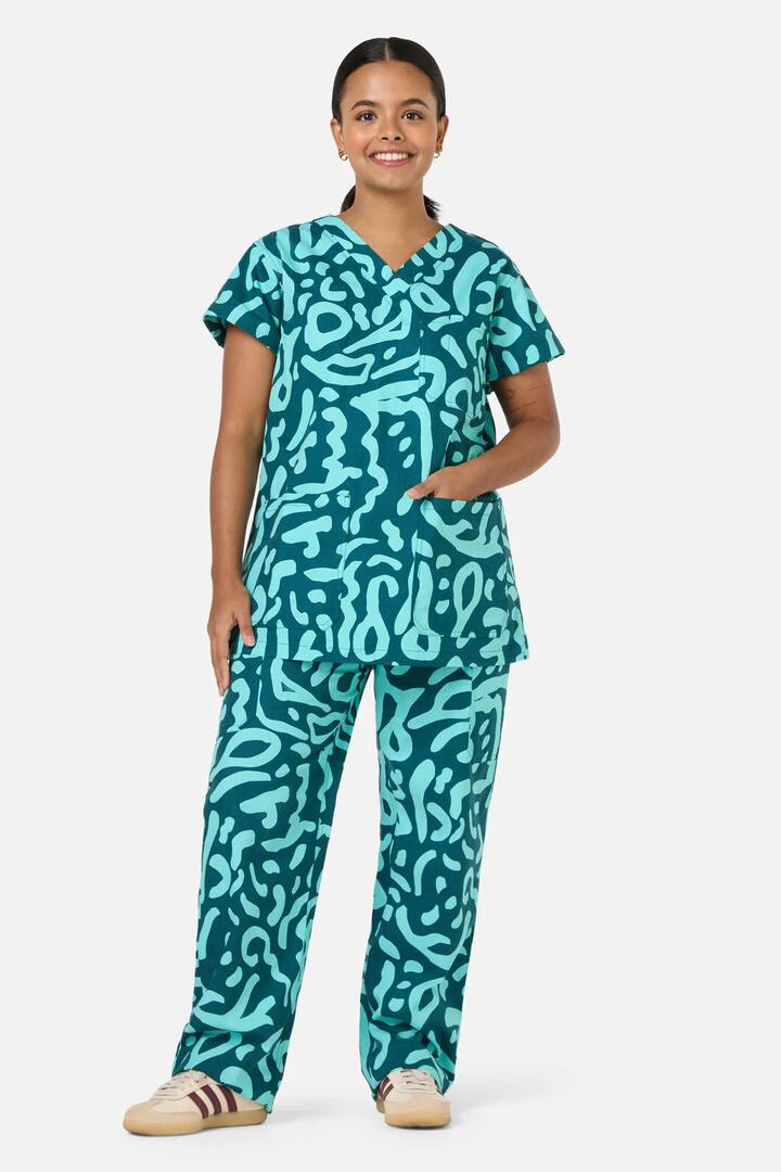 Image of a model wearing Uniforms & Workwear. Product name - Green Ripple Scrub Set in Green colour by brand - Gorman