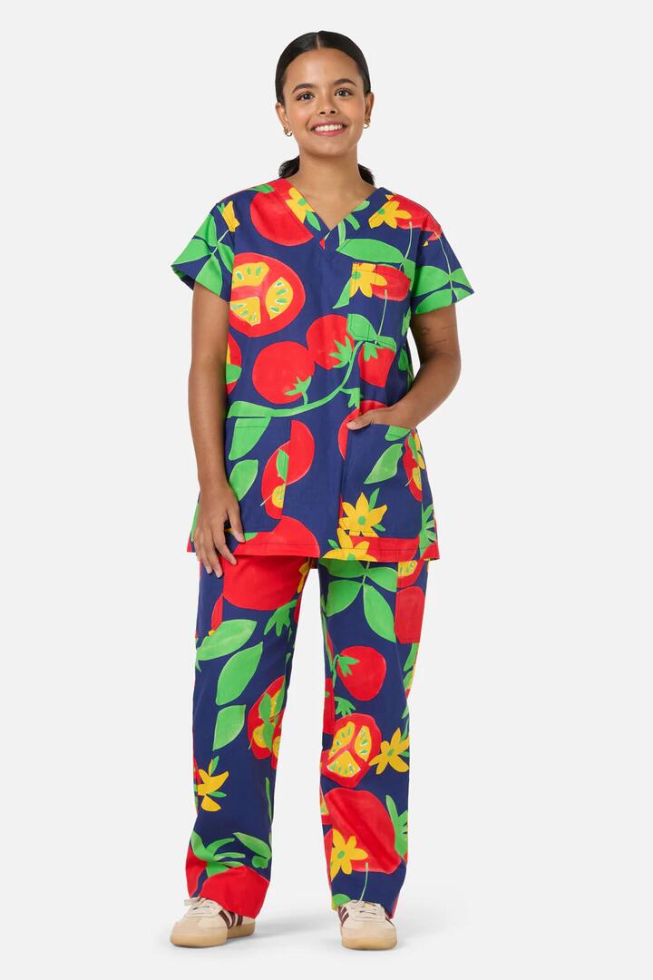 Image of a model wearing Uniforms & Workwear. Product name - Tomato Salad Scrub Set in Navy colour by brand - Gorman
