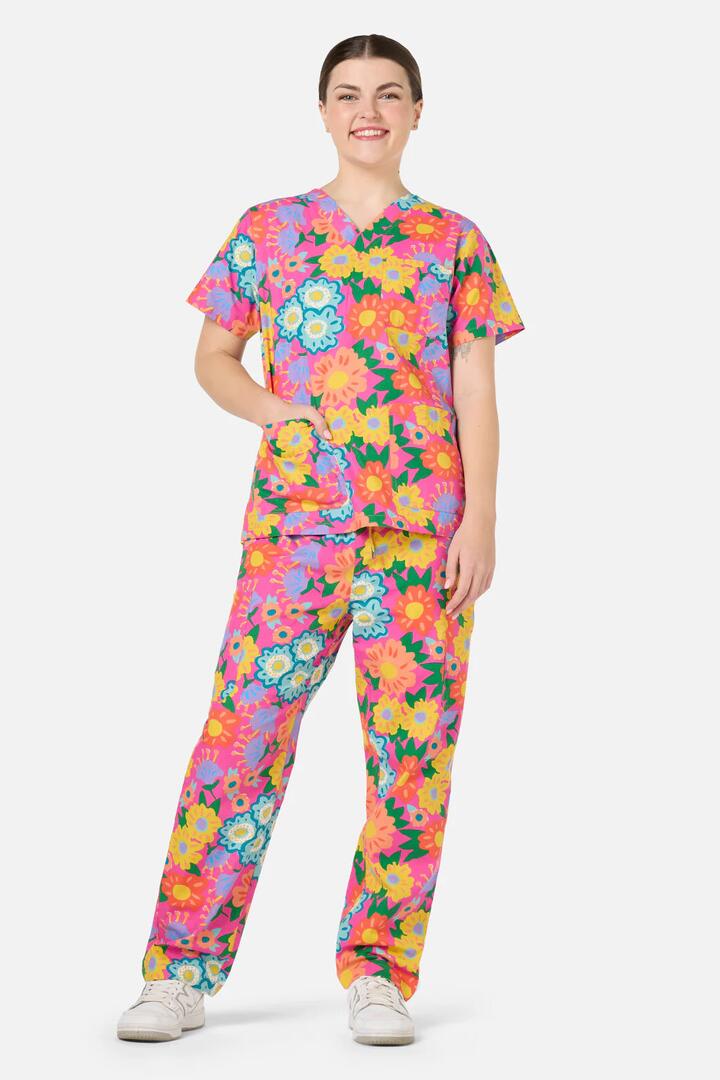 Image of a model wearing Uniforms & Workwear. Product name - Dream Garden Scrub Set in Pink colour by brand - Gorman