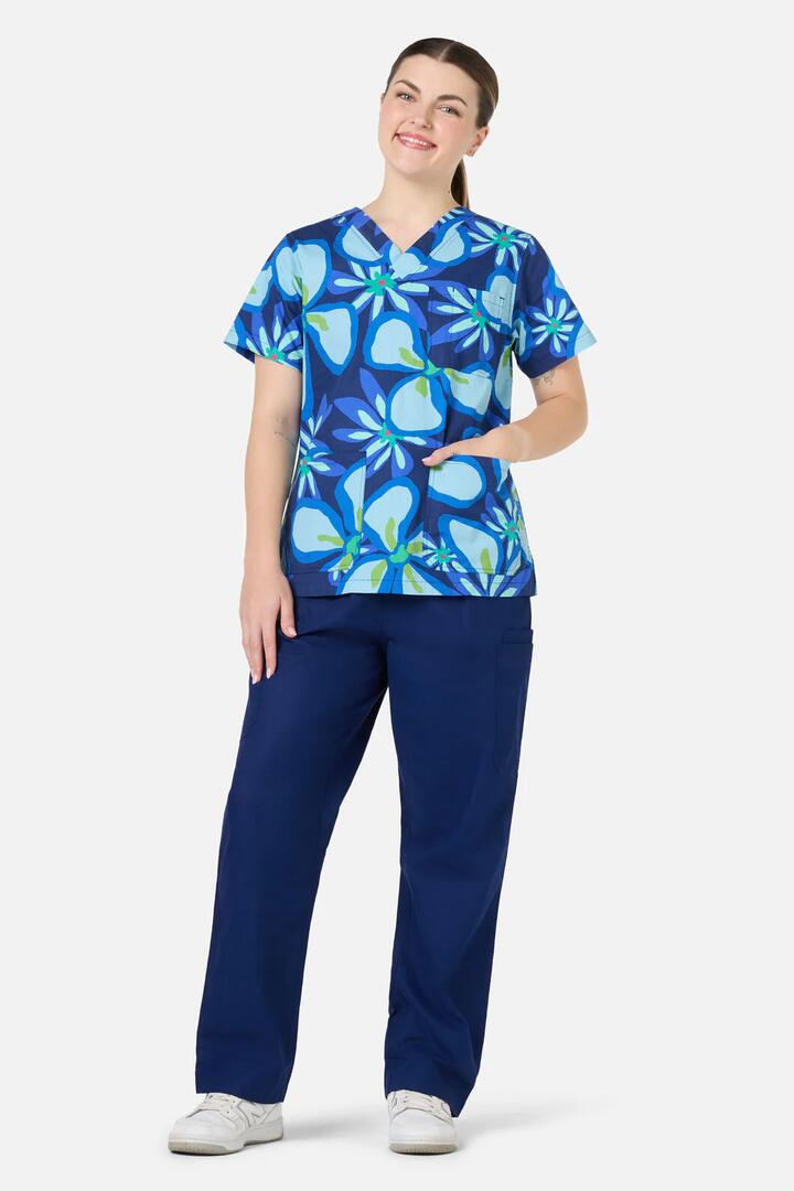Image of a model wearing Uniforms & Workwear. Product name - Florita Top & Pant Scrub Set in Navy colour by brand - Gorman