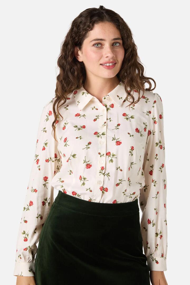 Image of a model wearing Tops. Product name - Evie Rose Long Sleeve Blouse in Cream colour by brand - Princess Highway