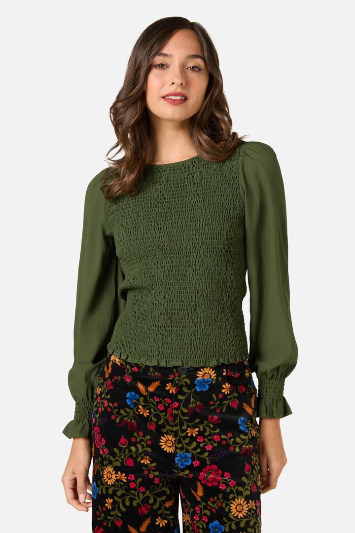 Image of a model wearing Tops. Productname: Ebony Shirred Long Sleeve Top in Dark Green colour by brand - Princess Highway
