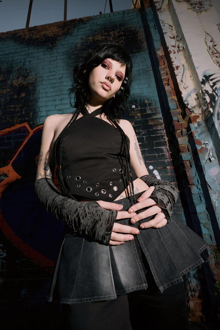 Image of a model wearing Tops. Productname: Enamored Goth Halter Top in Black colour by brand - Black Friday