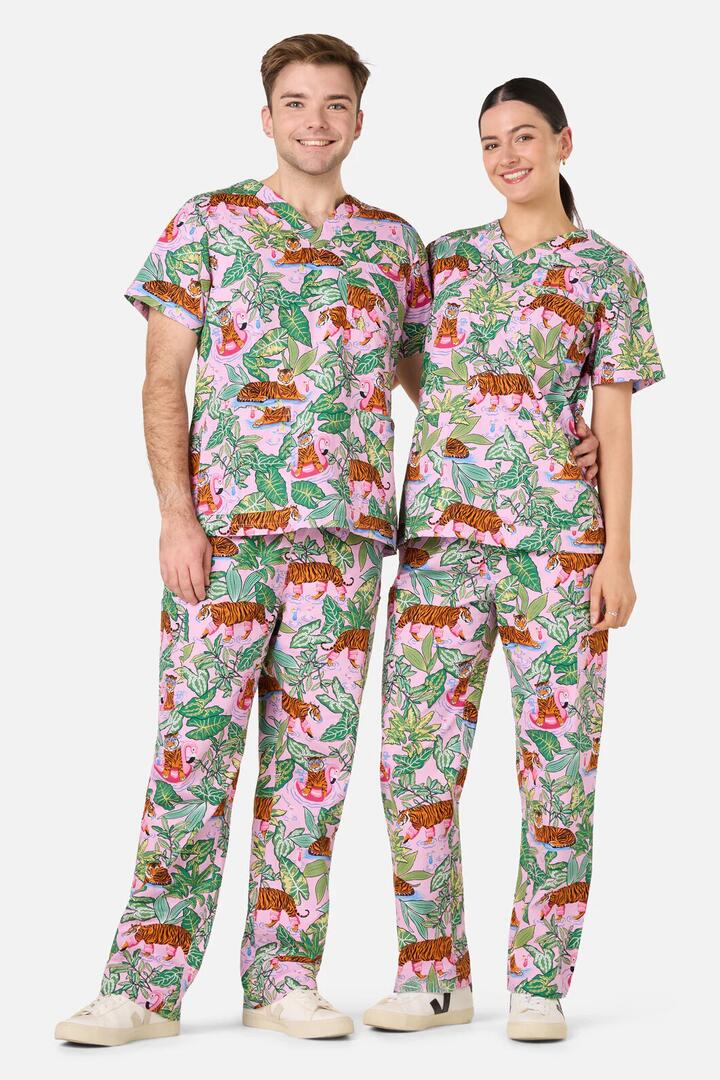 Image of a model wearing Uniforms & Workwear. Productname: Tiger Cocktail Party Scrub Set in Pink colour by brand - Scrubs With Love