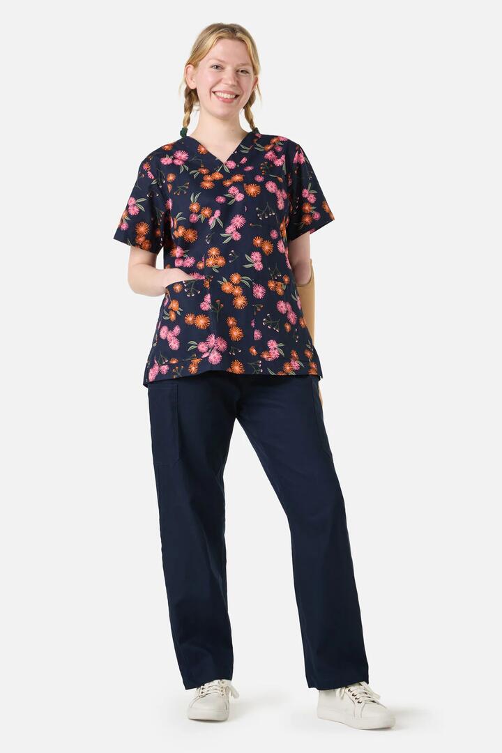 Image of a model wearing Uniforms & Workwear. Productname: Gumnut Puffs Top & Pant Scrubs in Navy colour by brand - Scrubs With Love