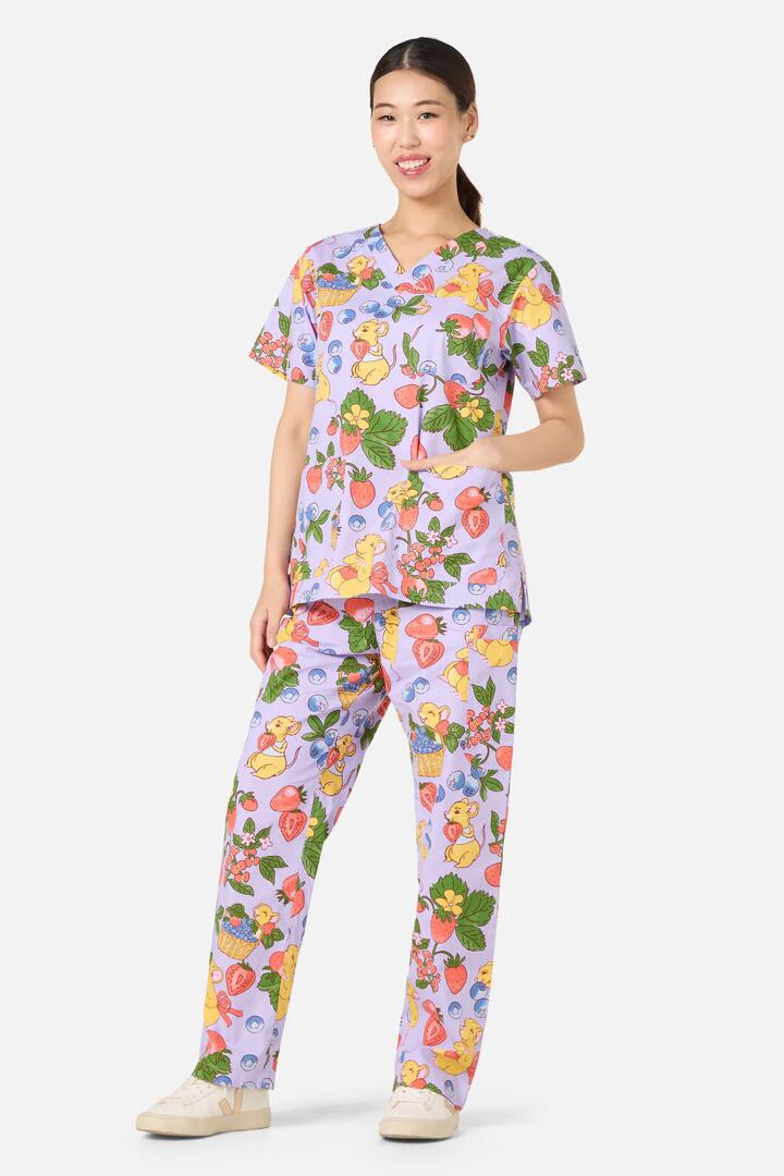 Image of a model wearing Uniforms & Workwear. Productname: Hamper Mouse Scrub Set in Lilac colour by brand - Scrubs With Love