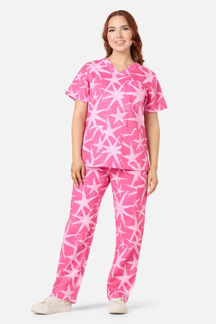 Image of a model wearing Uniforms & Workwear. Productname: Celestial Scrub Set in Pink colour by brand - Scrubs With Love