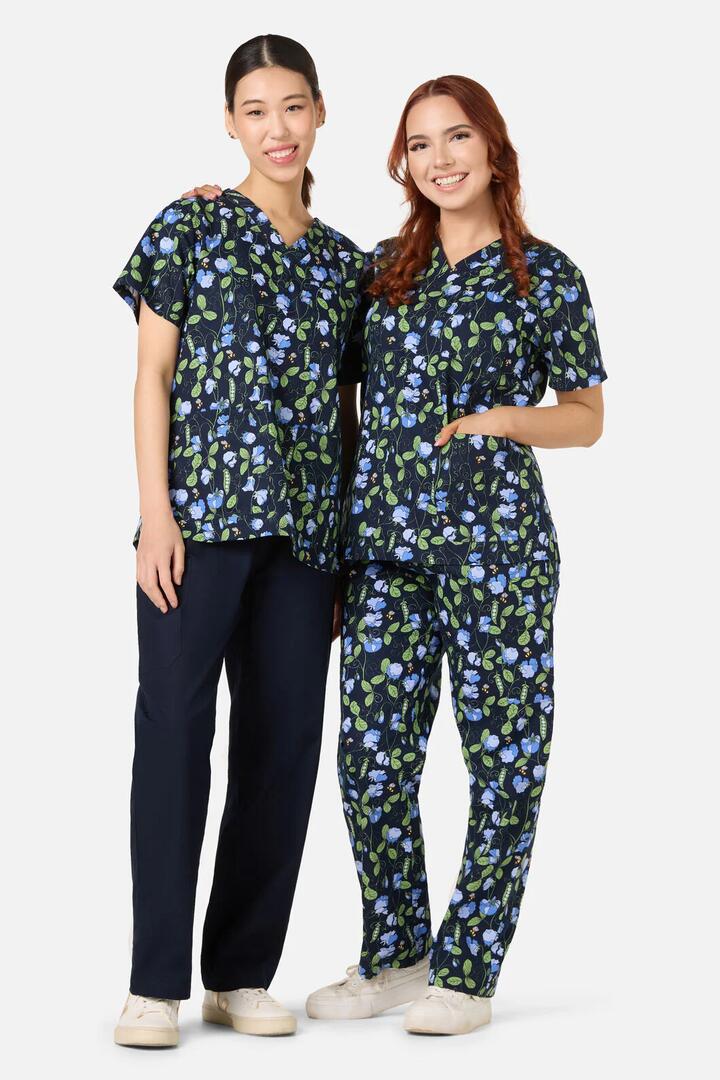 Image of a model wearing Uniforms & Workwear. Productname: Sweet Pea Scrub Set in Navy colour by brand - Scrubs With Love