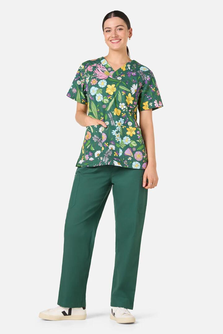 Image of a model wearing Uniforms & Workwear. Productname: Magical Garden Top & Pant Scrubs in Green colour by brand - Scrubs With Love