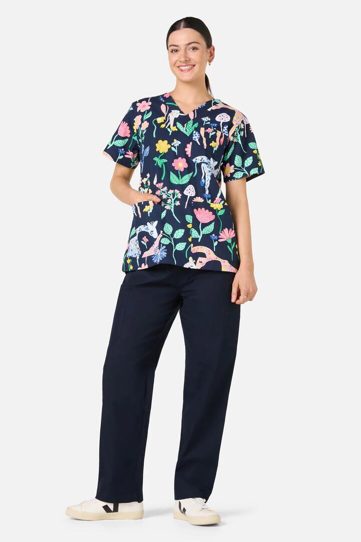 Image of a model wearing Uniforms & Workwear. Product name - Safari Top & Pant Scrub Set in Navy colour by brand - Gorman