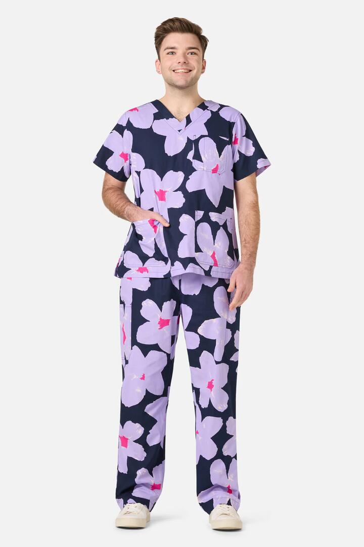 Image of a model wearing Uniforms & Workwear. Product name - Poppy Blue Scrub Set in Navy colour by brand - Gorman