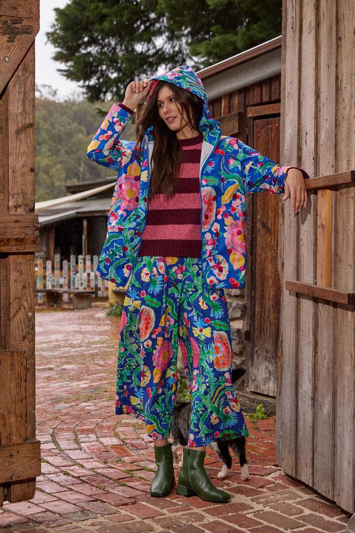 Image of a model wearing Rain Coats. Product name - Secret Meadow Print Raincoat in Print colour by brand - Gorman