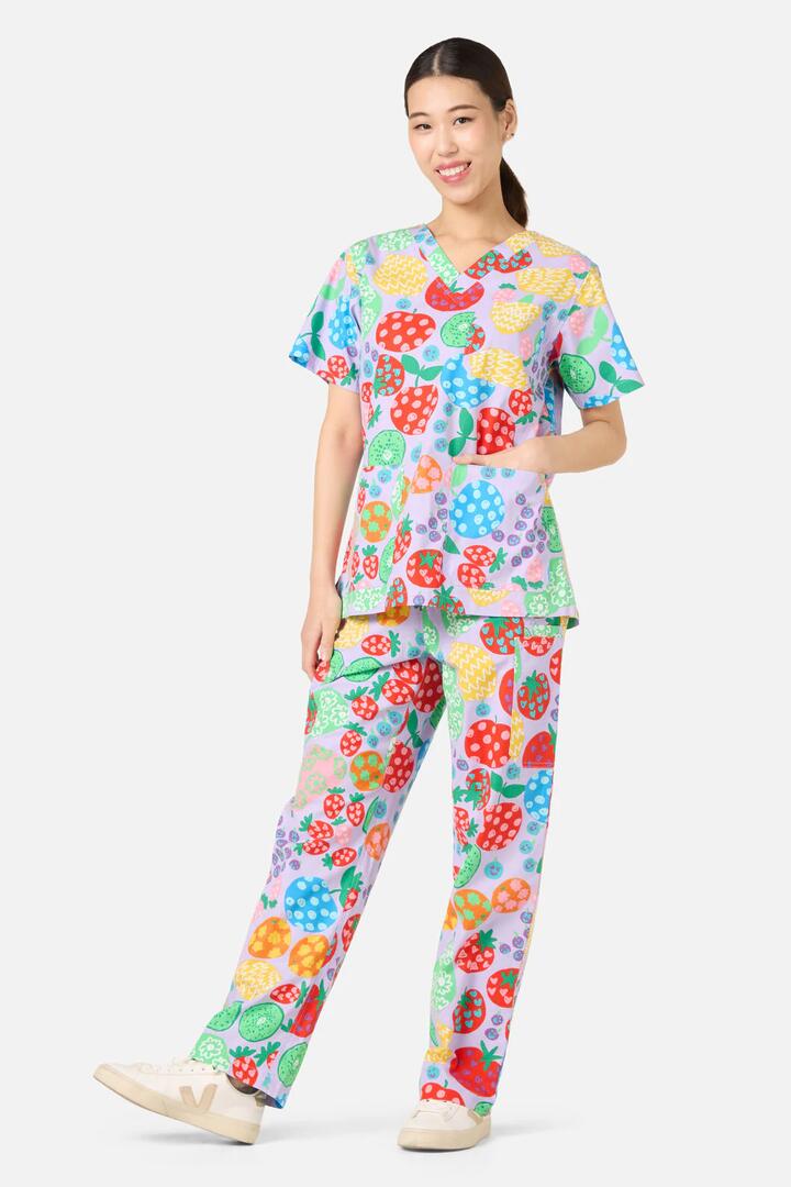 Image of a model wearing Uniforms & Workwear. Product name - Fruity Folk Scrub Set in Lilac colour by brand - Gorman