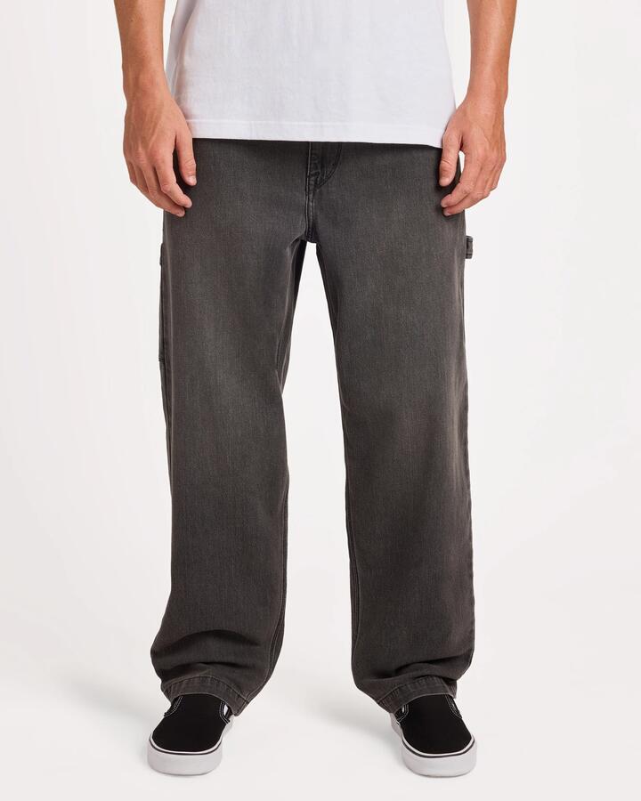 Image of a model wearing Pants. Product name - Volcom Mens Kraftsman Ii Carpenter Pants Black Grey in Black Grey colour by brand - Volcom
