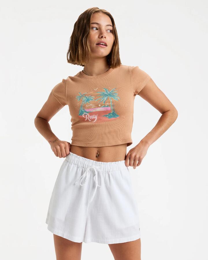 Image of a model wearing Shorts. Product name - Roxy Womens Place To Elastic Waist Shorts White in White colour by brand - Roxy