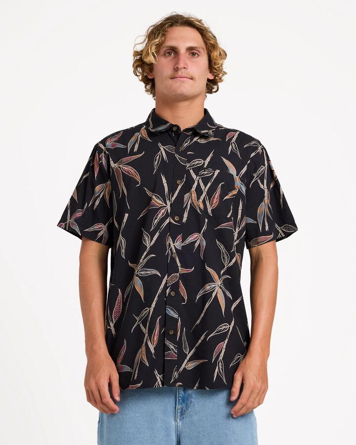 Image of a model wearing Tops. Product name - Volcom Mens Scaler Stone Woven Short Sleeve Shirt Vintage Black in Vintage Black colour by brand - Volcom