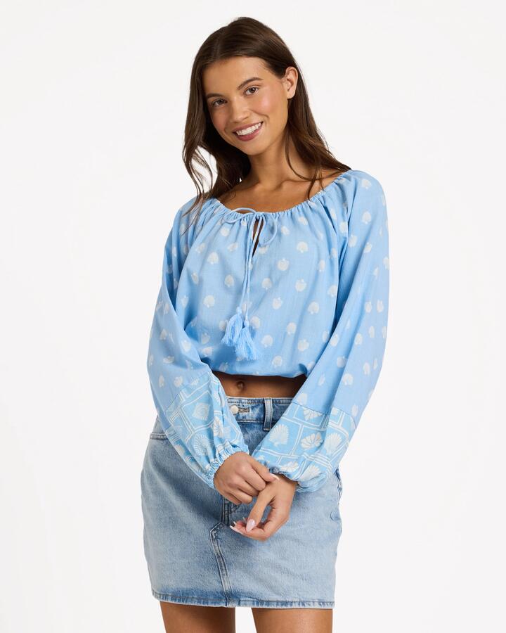 Image of a model wearing Tops. Product name - Roxy Womens Cactus Flower Long Sleeve Top Cerulean in Cerulean colour by brand - Roxy