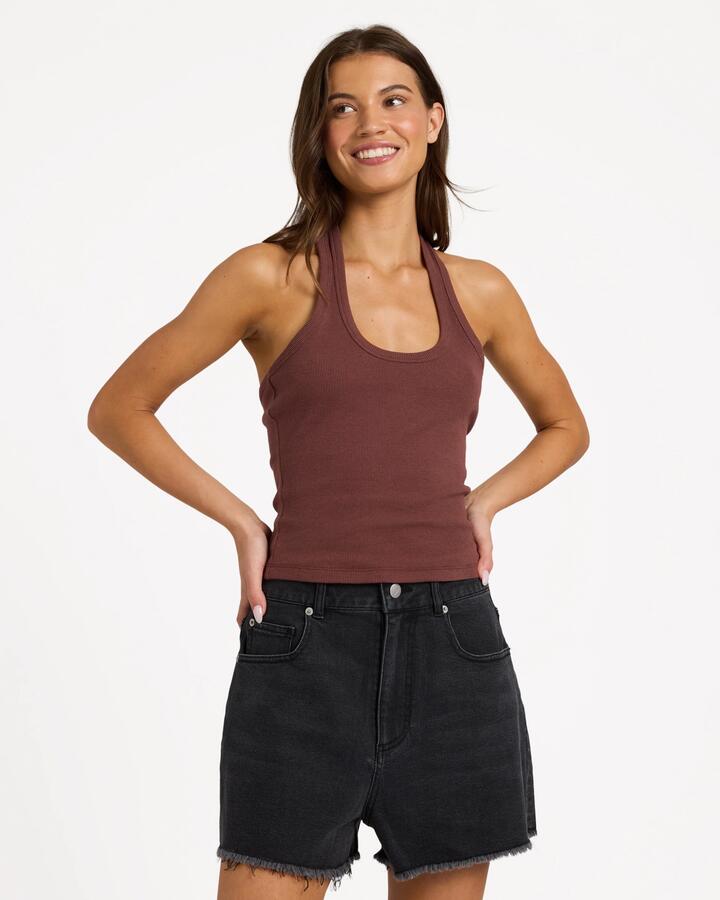 Image of a model wearing Tops. Product name - Roxy Womens Base Rib Halter Tank Top Java in Java colour by brand - Roxy