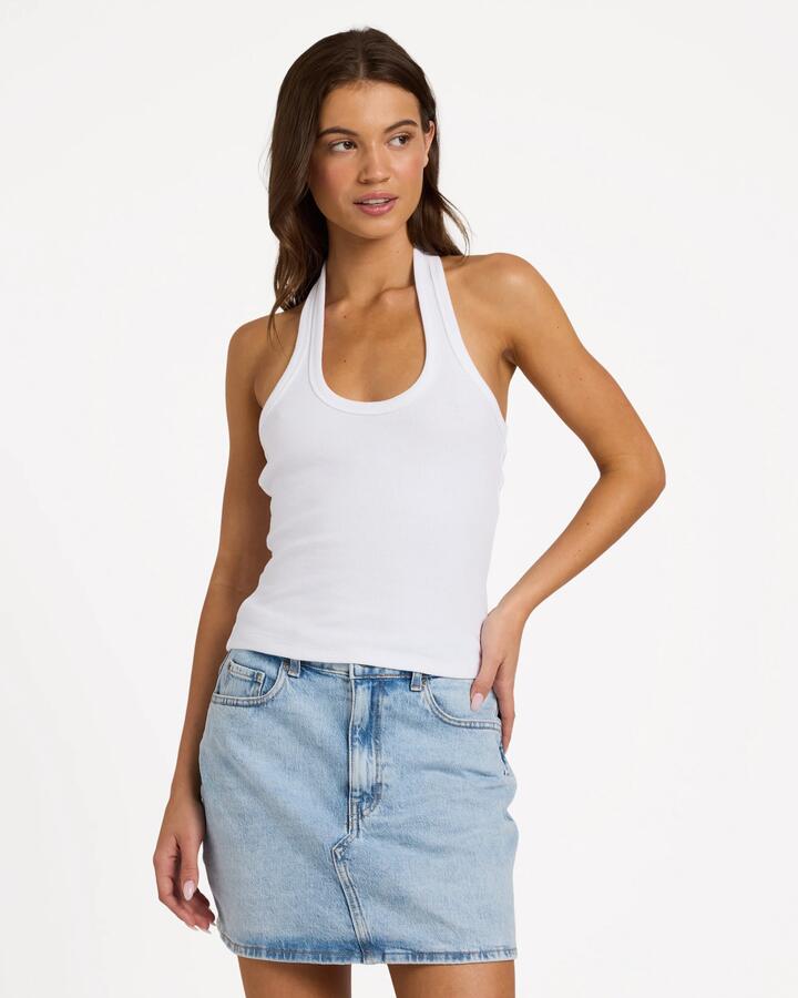 Image of a model wearing Tops. Product name - Roxy Womens Base Rib Halter Tank Top Bright White in Bright White colour by brand - Roxy