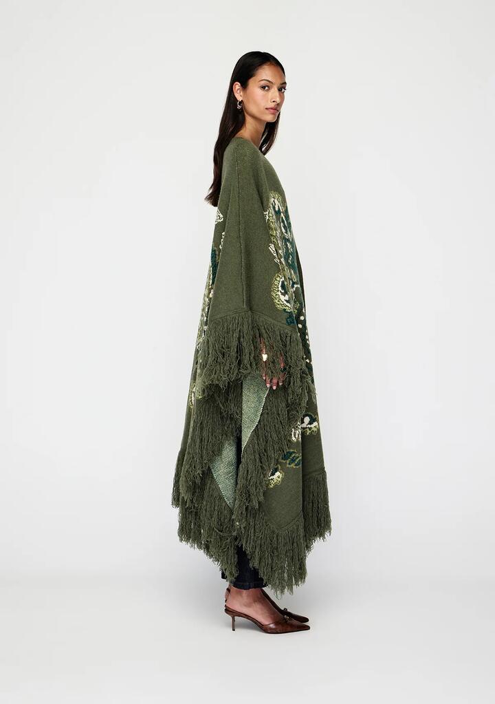 Image of a model wearing Outerwear. Productname: Sylva Jacquard Poncho | MOS The Label in Sylva Print colour by brand - MOS The Label